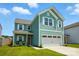 Charming two-story home with a two-car garage and a covered front porch at 133 Aspire Cir, Wingate, NC 28174