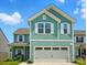 Charming two-story home with a two-car garage, landscaped yard, and a mix of shake and plank siding at 133 Aspire Cir, Wingate, NC 28174