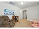 Cozy loft area with a bookshelf and comfortable chair at 133 Aspire Cir, Wingate, NC 28174