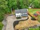 Beautiful aerial view of a modern farmhouse with fresh landscaping and long driveway at 136 Digh Cir # 4, Mooresville, NC 28117