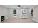 Living room with neutral paint, fireplace, modern floors, bright windows, and an exterior door at 136 Digh Cir # 4, Mooresville, NC 28117