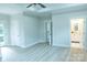 Spacious main bedroom with wood floors, tray ceiling, and ensuite bathroom access at 136 Digh Cir # 4, Mooresville, NC 28117