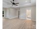 This main bedroom features an ensuite bathroom, access to a private deck, and light wood flooring at 136 Digh Cir # 4, Mooresville, NC 28117