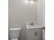 Bright half bathroom with white vanity, modern faucet, and large, round-edged toilet at 136 Digh Cir # 4, Mooresville, NC 28117