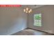Dining area featuring wood-look floors and a window overlooking the backyard at 1369 Secrest Commons Dr, Monroe, NC 28112