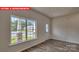 Bright entryway featuring wood-look floors and a large window overlooking the front yard at 1369 Secrest Commons Dr, Monroe, NC 28112