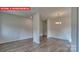 Open-concept living room featuring wood-look floors and recessed lighting at 1369 Secrest Commons Dr, Monroe, NC 28112