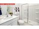 Modern bathroom featuring a quartz countertop, decorative towels, and glass-enclosed shower at 1373 Zermatt Ct, Monroe, NC 28112