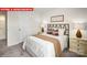 Cozy bedroom showcasing a patterned comforter, decorative pillows, and stylish bedside tables at 1373 Zermatt Ct, Monroe, NC 28112