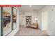 Open loft area featuring neutral walls, a comfortable chair, a stylish bookshelf, and natural light at 1373 Zermatt Ct, Monroe, NC 28112