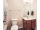 Nicely appointed bathroom with a toilet and single sink vanity with storage at 13820 Cypress Woods Dr, Huntersville, NC 28078