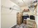 Walk-in closet with wire shelving and stored boxes and containers, providing ample storage space at 13820 Cypress Woods Dr, Huntersville, NC 28078