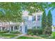 Inviting two-story house with blue shutters and lush green landscaping at 13820 Cypress Woods Dr, Huntersville, NC 28078