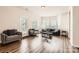 Comfortable living room with hardwood floors, neutral walls, and ample seating at 13820 Cypress Woods Dr, Huntersville, NC 28078