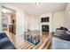 Open living area with fireplace, wood floors, and easy access to the kitchen at 13820 Cypress Woods Dr, Huntersville, NC 28078