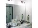 Modern bathroom featuring a marble countertop, black hardware, and walk-in shower at 1802 Cooper Ave, Kannapolis, NC 28081