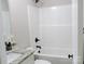 Updated bathroom features gray countertop, white sink and tub, and modern fixtures at 1802 Cooper Ave, Kannapolis, NC 28081