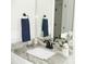 Bright bathroom with gray marble countertop, white sink, and black hardware at 1802 Cooper Ave, Kannapolis, NC 28081