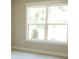 Bright bedroom showcasing large windows and neutral carpet at 1802 Cooper Ave, Kannapolis, NC 28081