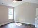 This bedroom has hardwood floors, vaulted ceiling and a window providing natural light at 1802 Cooper Ave, Kannapolis, NC 28081