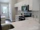 Bright kitchen featuring white cabinetry, stainless steel appliances, and gorgeous counters at 1802 Cooper Ave, Kannapolis, NC 28081
