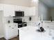 Modern kitchen with white cabinets, stainless steel appliances, and elegant countertops at 1802 Cooper Ave, Kannapolis, NC 28081