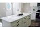 Close-up of the kitchen island with a marble countertop at 1802 Cooper Ave, Kannapolis, NC 28081