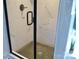 Walk-in shower with black trim and white tile with black fixtures at 1802 Cooper Ave, Kannapolis, NC 28081