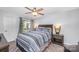 Bedroom with a sliding door that leads to a balcony, and two nightstands at 18741 Nautical Dr # 205, Cornelius, NC 28031