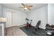 The exercise room includes fitness equipment, closet, ceiling fan, and hard surface floors at 18741 Nautical Dr # 205, Cornelius, NC 28031