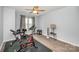 Exercise room features fitness equipment, ceiling fan, and a window for natural light at 18741 Nautical Dr # 205, Cornelius, NC 28031