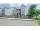 Attractive condo exterior featuring multiple floors and manicured lawn and ample parking at 18741 Nautical Dr # 205, Cornelius, NC 28031