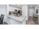 Modern kitchen with granite countertops, stainless appliances, and bright white cabinets at 18741 Nautical Dr # 205, Cornelius, NC 28031