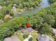 Aerial view of a house on a wooded lot in Tega Cay, SC, near the lake, with a red star marking its location at 2004 Marquesas Ave, Tega Cay, SC 29708