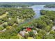 Aerial view of property at 2004 Marquesas near Lake Wylie surrounded by mature trees and other homes at 2004 Marquesas Ave, Tega Cay, SC 29708