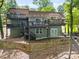 Back of the house with multiple decks and stairs leading down to the lake and lakeside activities at 2004 Marquesas Ave, Tega Cay, SC 29708