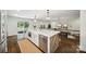 Spacious kitchen with a large island, stainless steel appliances, and hardwood floors at 2004 Marquesas Ave, Tega Cay, SC 29708