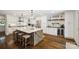 Well-lit kitchen with a center island, stainless steel appliances, and a coffee bar area at 2004 Marquesas Ave, Tega Cay, SC 29708