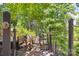 Easy access to lake with steps and a lakeside bench, inviting relaxation and enjoyment of the waterfront at 2004 Marquesas Ave, Tega Cay, SC 29708