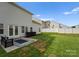 Well-manicured backyard with ample space, a patio area, and lush grass, perfect for outdoor activities at 204 Fesperman Cir, Troutman, NC 28166