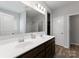 Bathroom featuring double sink vanity with sleek countertops and modern fixtures, offering a clean and functional space at 204 Fesperman Cir, Troutman, NC 28166