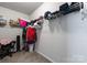 Walk-in closet with ample shelving and storage space, providing an organized solution for clothing and accessories at 204 Fesperman Cir, Troutman, NC 28166