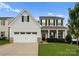 Charming two-story home with a well-manicured lawn and attached two-car garage at 204 Fesperman Cir, Troutman, NC 28166