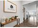 Hallway featuring a wooden console table and a decorative picture, leading to the living area at 204 Fesperman Cir, Troutman, NC 28166