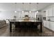 Spacious kitchen featuring a large island, granite countertops, and modern stainless steel appliances at 204 Fesperman Cir, Troutman, NC 28166