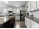 Close-up of a kitchen showcasing granite countertops and stainless steel appliances at 204 Fesperman Cir, Troutman, NC 28166