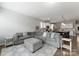 Open-concept living room featuring a comfortable sectional sofa and seamless access to the kitchen at 204 Fesperman Cir, Troutman, NC 28166