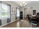 Bright home office featuring neutral walls, wood floors, a chandelier, and a workspace at 204 Fesperman Cir, Troutman, NC 28166