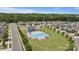 A community pool and recreation area within a neighborhood, surrounded by lush greenery and homes at 207 Welcombe St, Mooresville, NC 28115