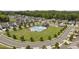 Aerial view of neighborhood pool, recreation area, and surrounding homes in a planned community at 207 Welcombe St, Mooresville, NC 28115
